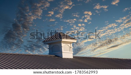 Wood cupola on an old pier roof under blue sky