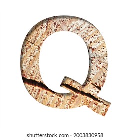 Wood Cut Font. The Letter Q Cut Out Of Paper On The Background Of A Cut Of A Tree With Cracks And Shavings. Set Of Decorative Natural Alphabet Fonts.