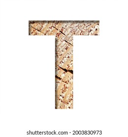 Wood Cut Font. The Letter T Cut Out Of Paper On The Background Of A Cut Of A Tree With Cracks And Shavings. Set Of Decorative Natural Alphabet Fonts.