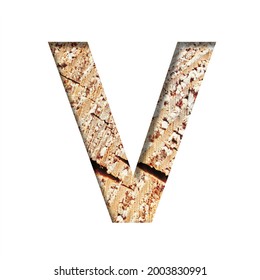 Wood Cut Font. The Letter V Cut Out Of Paper On The Background Of A Cut Of A Tree With Cracks And Shavings. Set Of Decorative Natural Alphabet Fonts.