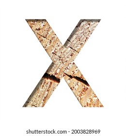 Wood Cut Font. The Letter X Cut Out Of Paper On The Background Of A Cut Of A Tree With Cracks And Shavings. Set Of Decorative Natural Alphabet Fonts.