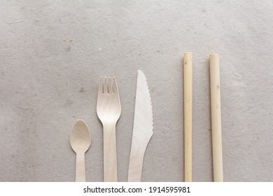 wood cutlery over recycle paper