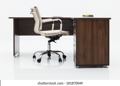 Wood Desk And Chair On A White Wall