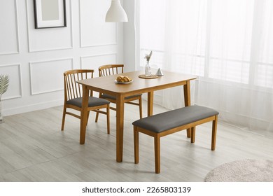 Wood dining table landscape with sunlight. - Powered by Shutterstock