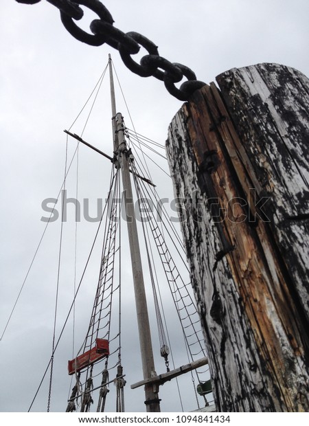 wood dock pole and ship\
mast