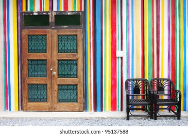 Wood Door And Black Chair On Colorful Wall