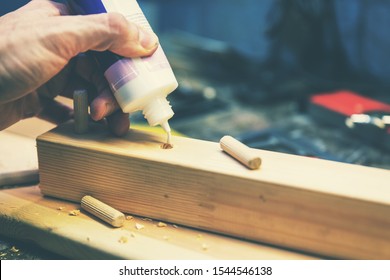 Wood Dowel Joint - Joiner Put The Glue Into A Drilled Wooden Hole