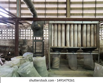 Wood Dust Filtration System From Wood Cutting Panel Saw Machine At The Furniture Factory.Dust Collector In Woodworking Shop.