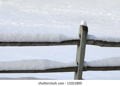 Wood Fence Covered With Snow