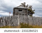 Wood Fence and old Log Building at Fuerte Bulnes, Famous Historic Chile Fort on the Strait of Magellan near Punta Arenas, Chilean Patagonia, South America