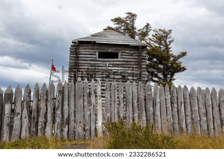 Wood Fence and old Log Building at Fuerte Bulnes, Famous Historic Chile Fort on the Strait of Magellan near Punta Arenas, Chilean Patagonia, South America