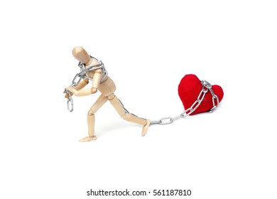 Wood Figure Mannequin using chain to pull big red heart                                         