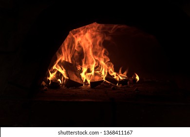 wood fired oven burning wood