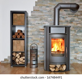 wood fired stove with fire-wood, fire-irons, and briquettes from bark