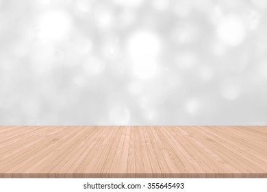 Wood floor with blur background white silver bright sparkling light glittering bokeh illumination