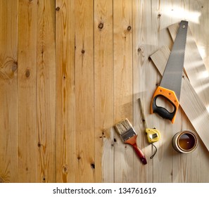 Wood Floor With A Brush, Paint And Tools