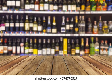 Wood Floor And Wine Liquor Bottle On Shelf - Blurred Background