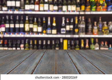 Wood Floor And Wine Liquor Bottle On Shelf - Blurred Background