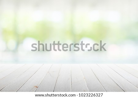 Wood flooring with glass office. atmosphere around office  blur background with bokeh.