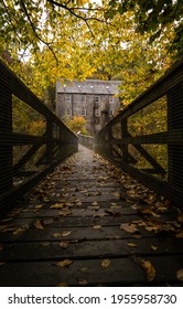 Wood Foot Bridge With Old Jute Mill In Background 