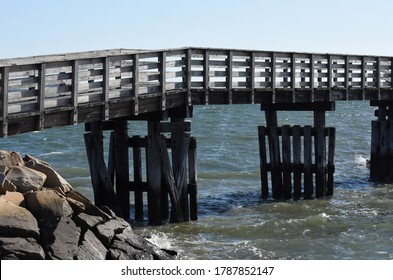 Wood Foot Bridge Over The Ocean In Plymouth, Massachusetts.