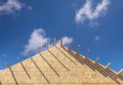 Wood frame house construction. Shape of a triangle, an Industrial Photo by David Papazian