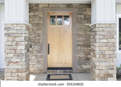 Wood Front Door Of A Home. View Of A Rustic Front Door In Modern