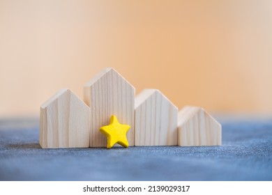 Wood Home With Star For Hot Real Estate Offer For Customer. Residential Buildings. Concept Of Real Estate Market. Housing Market Predictions, Trends And Tendencies. Mortgage Loan. Economic Analysis.