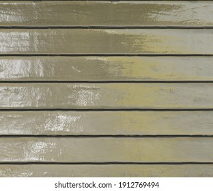 Wood with horizontal arrangement with reflection of sun, its blur and shiny, is perfect for backgrounds and textures