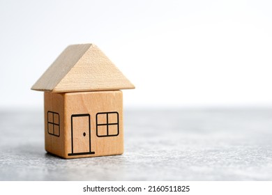 Wood House Model.Choosing The Right Home And Housing Development ,community.Property Insurance Protection And Buying House Concept. Investment Mortgage Concept By Wood Block House                     