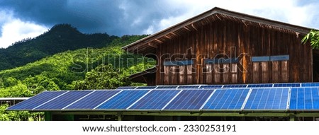 Wood house in mountain install solar panels generate electric power, mountain home using solar cells for alternative electricity, sustainable green energy and environmental building