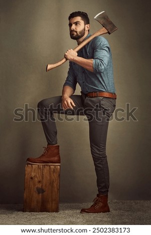 Wood, lumberjack and man with axe in studio for deforestation, commercial logging or furniture. Thinking, timber and male logger with sharp tool for sustainable environmental impact for biodiversity.