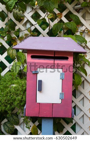 Wood mailbox.