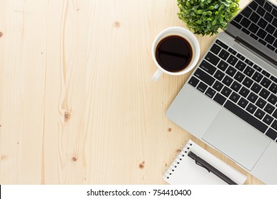 wood office desk table with computer, office supplies. and coffee cup.
 Top view with copy space flat lay.
 - Powered by Shutterstock