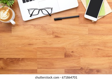 Wood Office Desk Table With Laptop Computer, Cup Of Coffee And Supplies. Top View, Flat Lay.