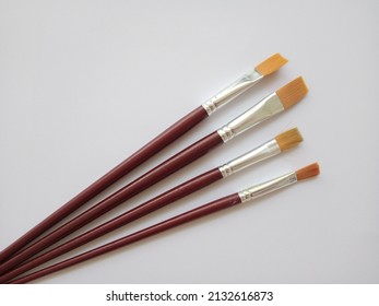 wood paintbrushes isolated on white background - Shutterstock ID 2132616873