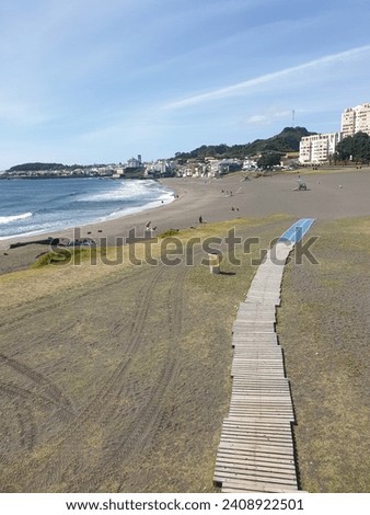 wood path to sand beach on sunny day in sao Miguel island at the azores archipelago