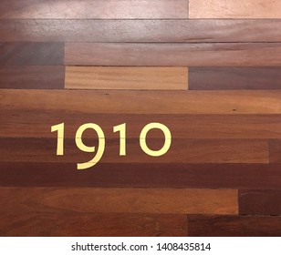 Wood Pattern With Golden Numbers Of Tate Britain, Westminster, London, UK.