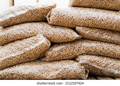 Wood pellets in plastic bags. Environmentally friendly fuel.Wood pellets stacked.