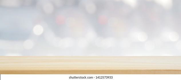 Wood Plank Table Top On Blur And Bokeh Abstract Gray And White Tone Using For Banner Design And Background Or Shelf Display Product Layout, Landscape Shot Photo.