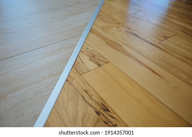 Wood Planks Or Bevelled Laminates And Tiles Are Joined Together By Aluminum Seam Frame. Decorative Strip For Floor Or Window Sill