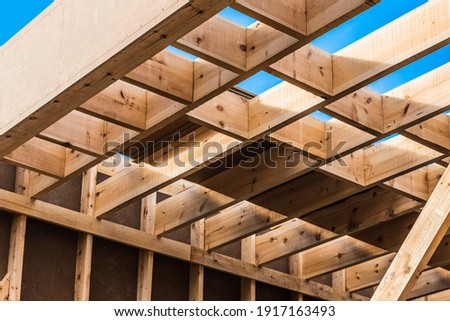 Wood planks s for walls and beams in the construction of a new sustainable wooden house.