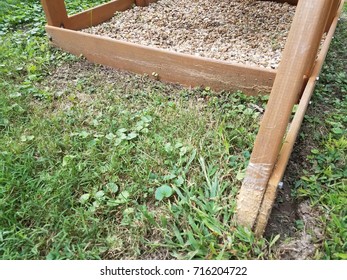 A Wood Play Structure Hit By A Lawn Mower Or Weed Wacker