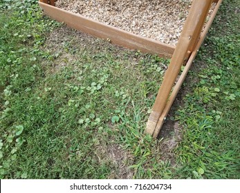 A Wood Play Structure Hit By A Lawn Mower Or Weed Wacker