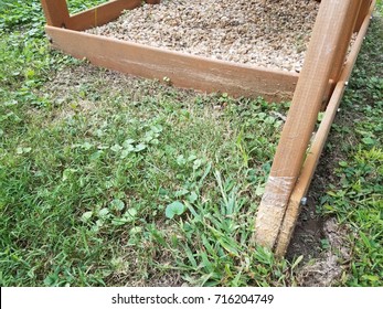 A Wood Play Structure Hit By A Lawn Mower Or Weed Wacker