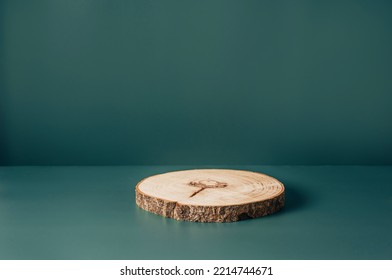 Wood Podium Saw Cut Of Tree On Dark Teal Background. Concept Scene Stage Showcase, Product, Promotion Sale, Presentation, Beauty Cosmetic. Trendy Color 2023