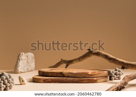 Wood podium, wooden pieces on beige background for cosmetic product mockup.