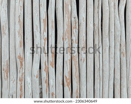 Wood pole fence wall background. White wooden fence texture. Wooden wall texture. Wood texture background.