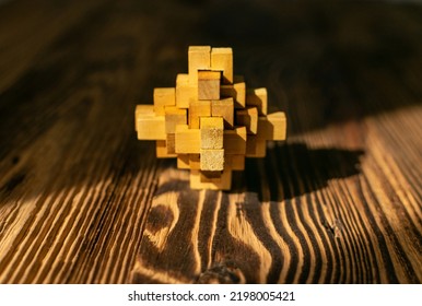 Wood Puzzle, Brain Teaser Closeup. Wooden Game Block, Brainteaser, Logic Game, Mechanical Puzzles, Logic 3d Toy, Wood Puzzle With Selective Focus