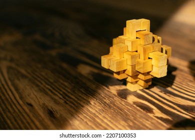 Wood Puzzle, Brain Teaser Closeup. Wooden Game Block, Brainteaser, Logic Game, Mechanical Puzzles, Logic 3d Toy, Wood Puzzle With Selective Focus